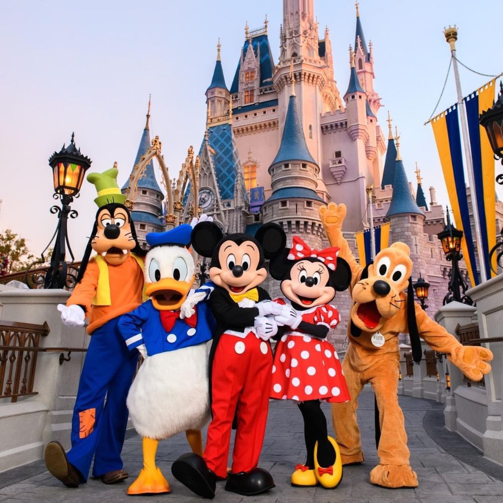 Disney Characters in front of Disney Magic Kingdom